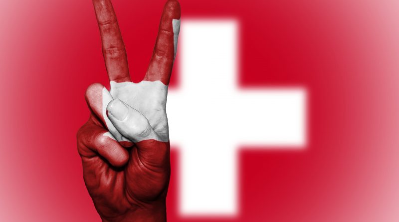 Flagge der Schweiz und Friedenssymbol
